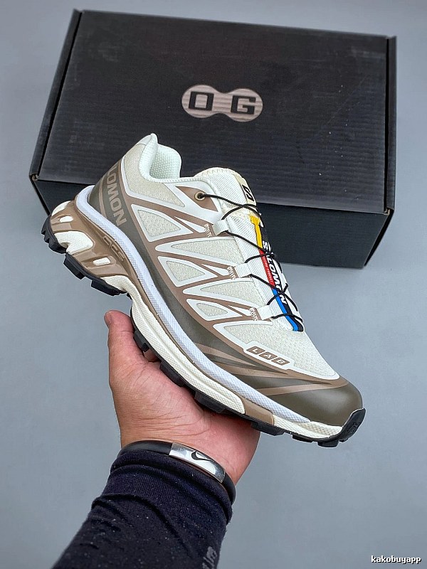Salomon Tan and Gray Trail Runners Defined by Treaded Trail Sole