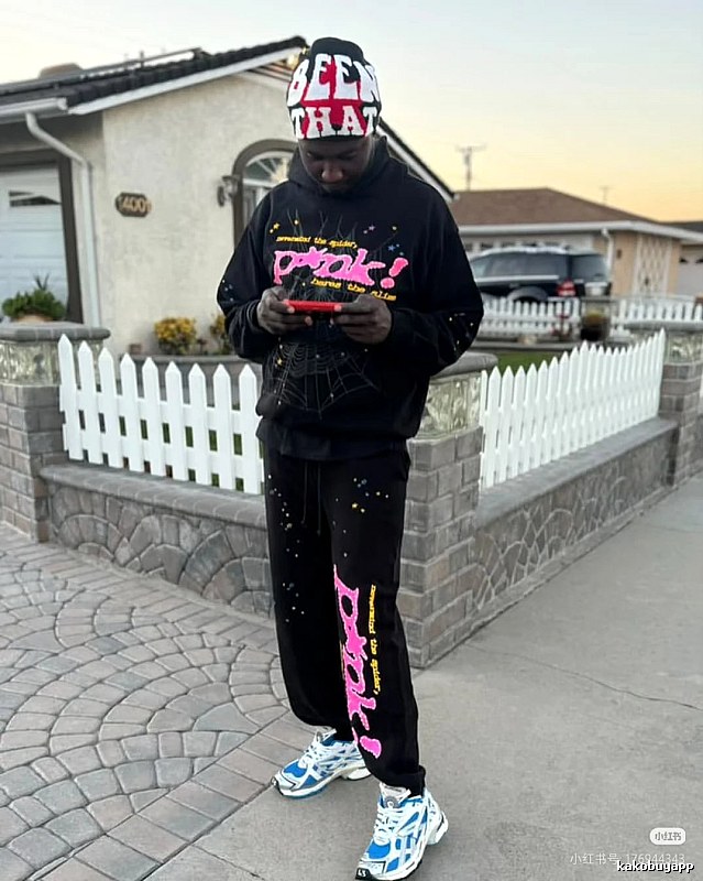 Streetwear Sweatpants with bright pink graphics and a relaxed cuffed fit - Sp5der Layering Edit